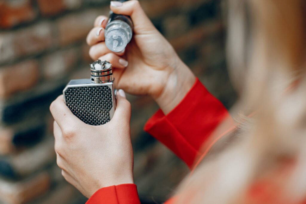 stylish young girl in a city with vape